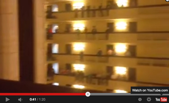 High school students sing the national anthem